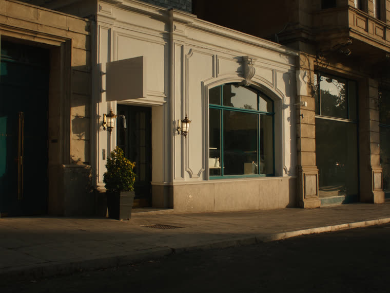 Local business storefront at golden hour